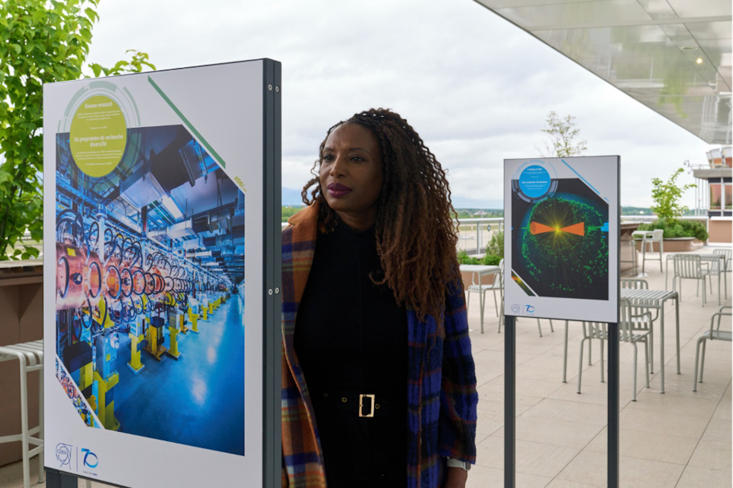 A woman looking at an exhibition panel